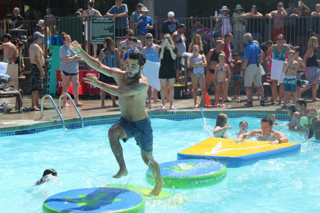 People competing in pool games, one of the many events taking place at Woodloch in the Poconos.