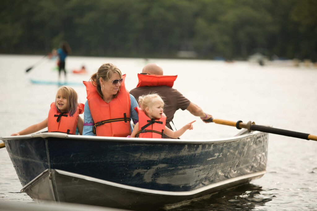 A family on a rowboat during a Labor Day weekend getaway to Woodloch in the Poconos.