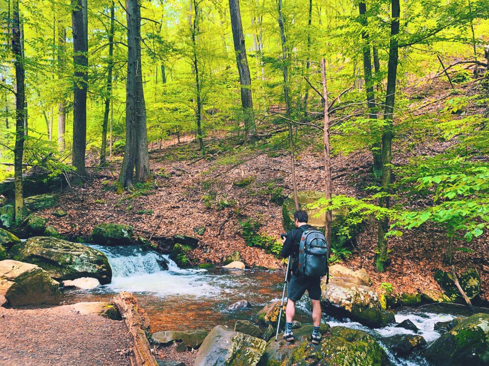 A person exploring one of the hiking trails in the Poconos.