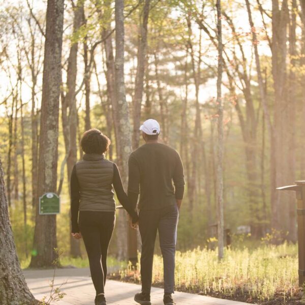 Two people going for a walk at one of the best Poconos resorts for couples.