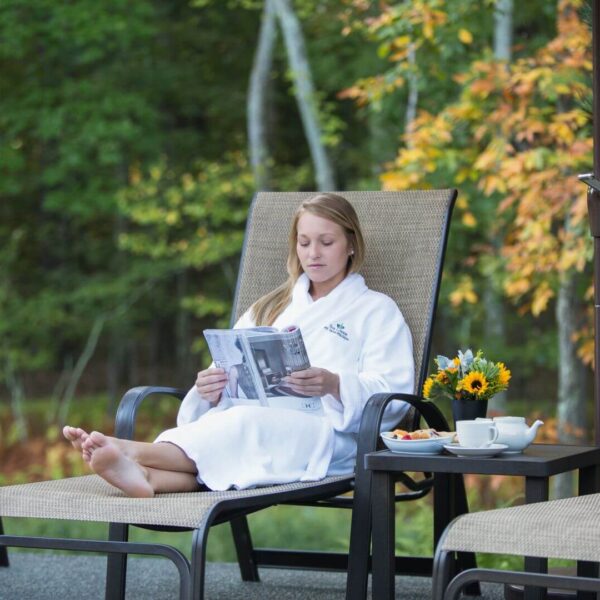 A woman relaxing on a solo vacation in the Poconos.