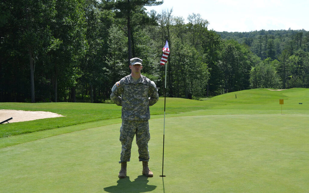 A military member on the golf course during a tournament, one of the ways Woodloch is giving back to the community.