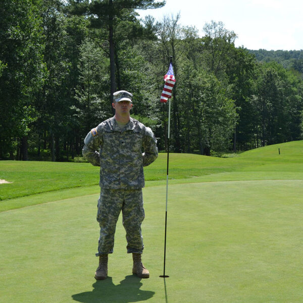 A military member on the golf course during a tournament, one of the ways Woodloch is giving back to the community.