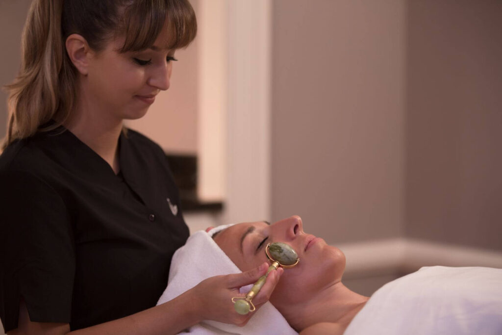 A woman getting a facial at a spa resort in Poconos, PA.