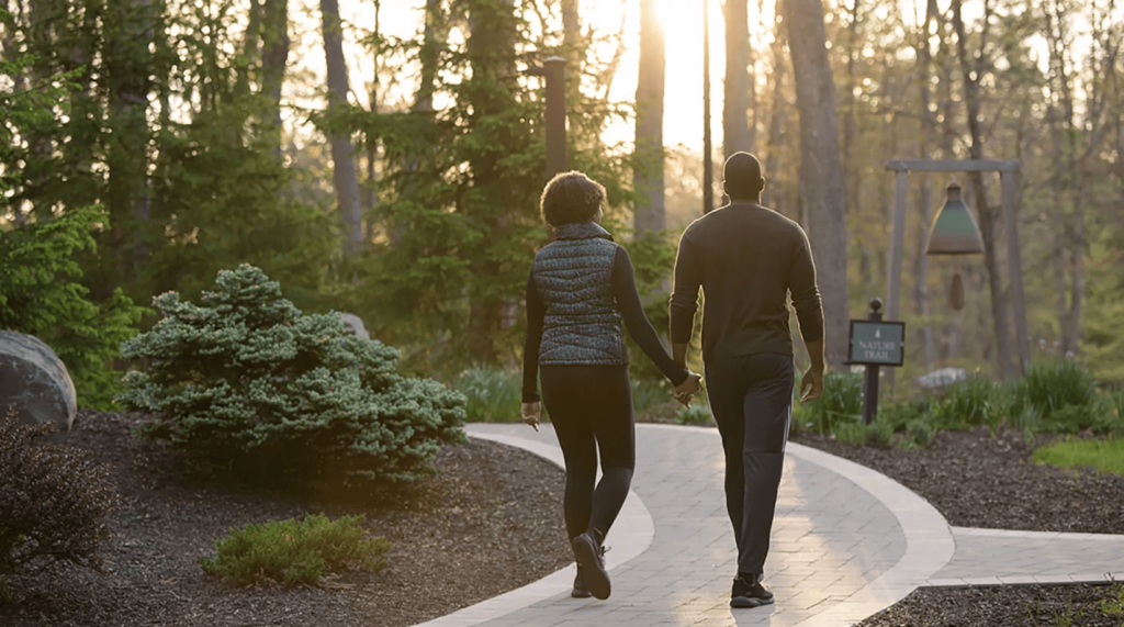 A couple going for a walk during a romantic Poconos weekend getaway.