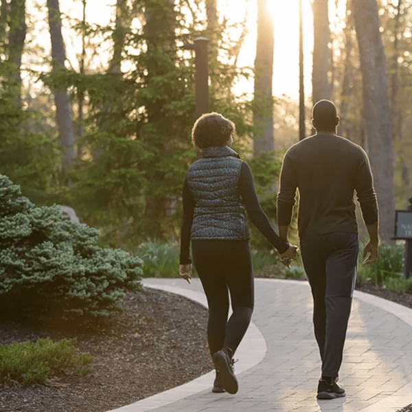 A couple going for a walk during a romantic Poconos weekend getaway.